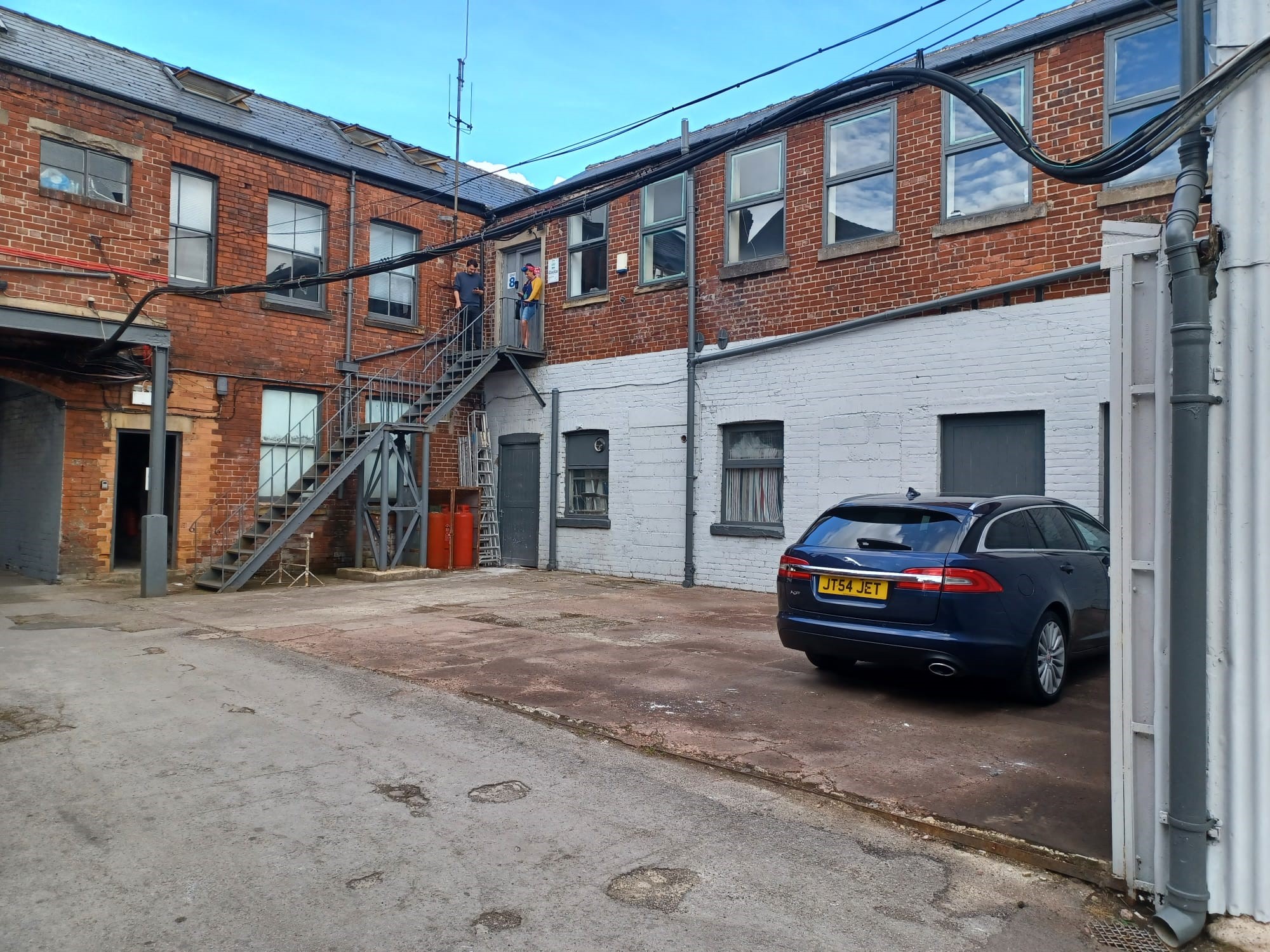 Brick buildings and the external staircase around the Gordon Works courtyard